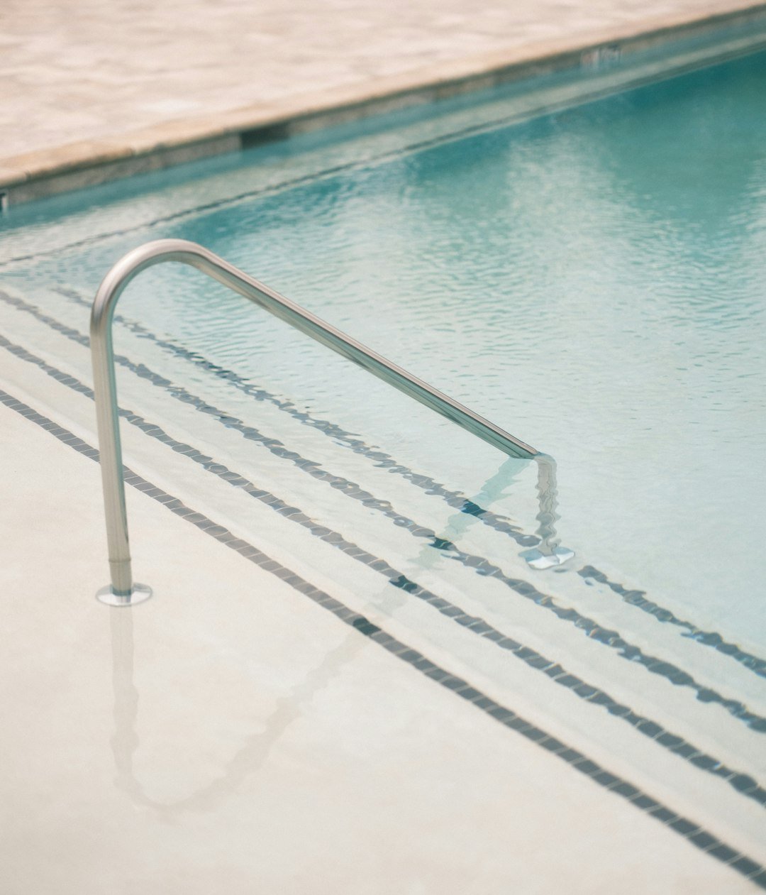 a-metal-railing-in-a-pool-wfxbsjtmdqa
