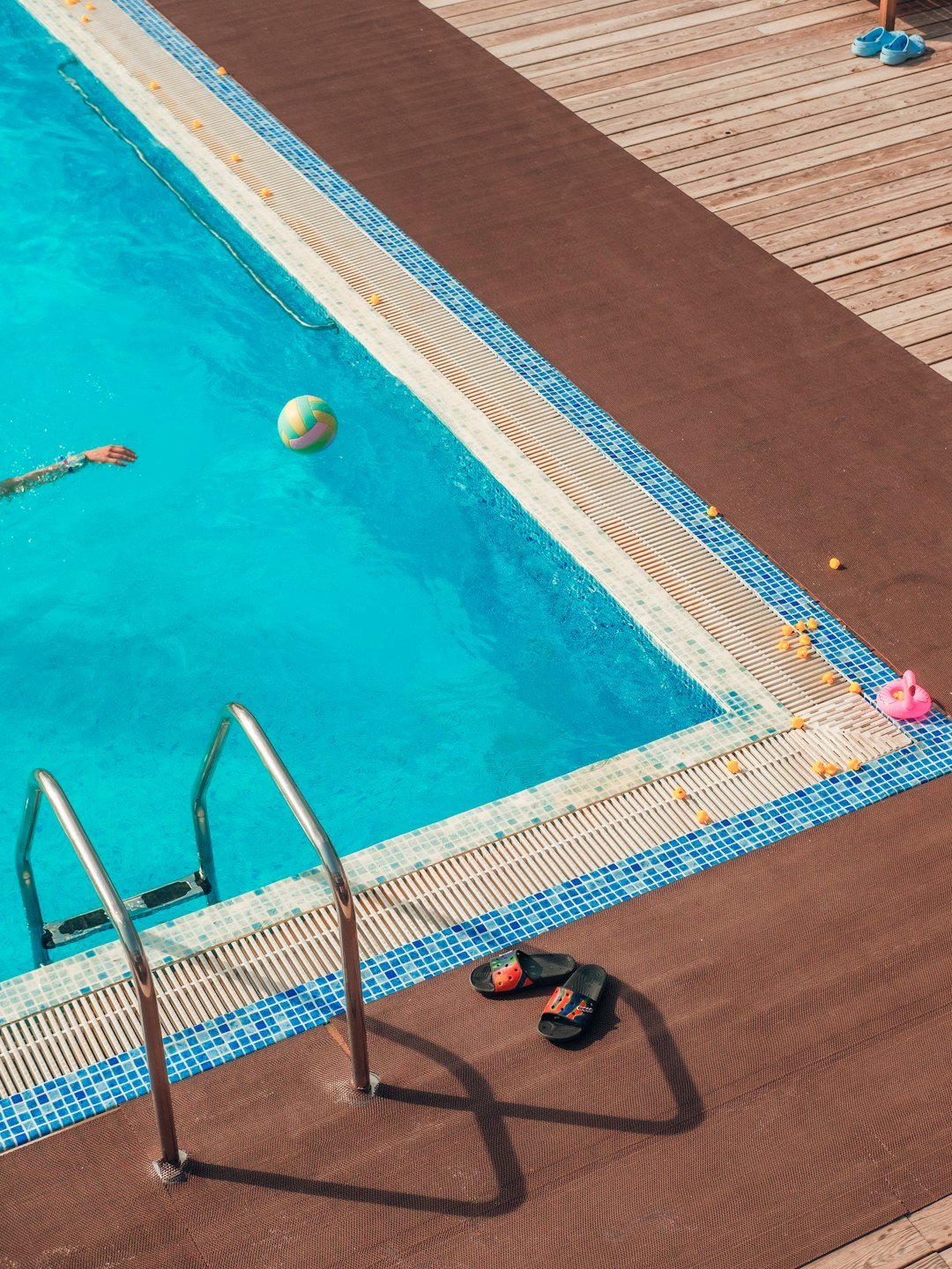 a-swimming-pool-with-a-person-and-toys-ibda1o8fn4g